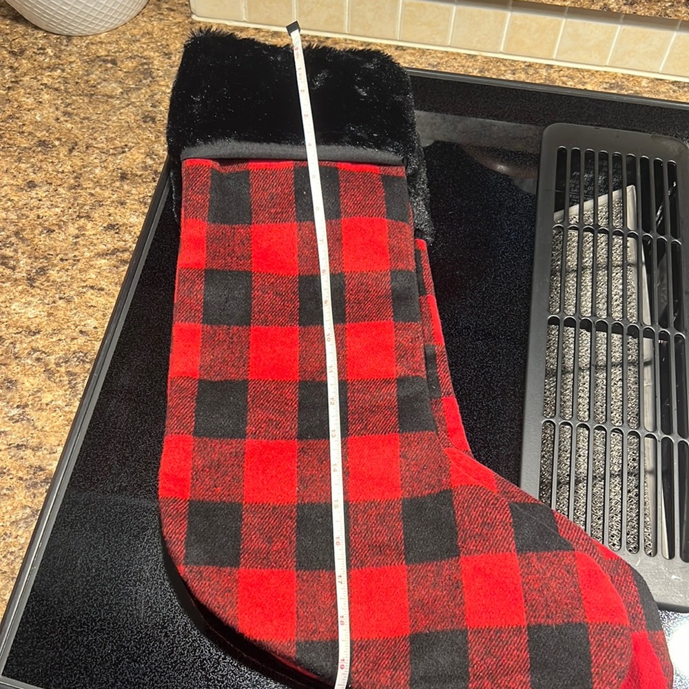 Three buffalo plaid, red and black Christmas stockings